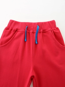 Pantalon de sport rouge pour filles avec taille élastique et cordon de serrage bleu contrasté