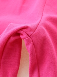 Detailed crotch seam of girls fuchsia knit joggers showing premium fabric and stitching