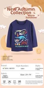 Detail of navy boy's t-shirt showing 100% cotton fabric info and dinosaur print