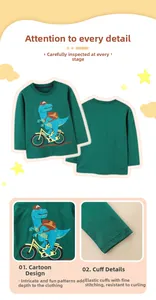 Detail of cartoon blue dinosaur print and elastic cuffs on a dark green boy's t-shirt
