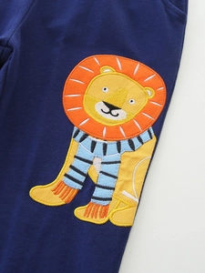 Boy's navy blue cotton knit joggers featuring a detailed cartoon lion embroidery patch