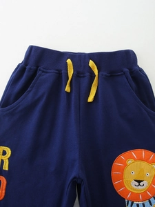 Boys navy blue joggers with yellow drawstring and lion embroidery on soft cotton fabric