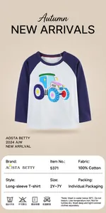 Detail view of boys long sleeve raglan tee with colorful tractor print and 100% cotton fabric