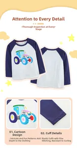 Detail of cartoon tractor print and elastic cuffs on boys long sleeve cotton shirt