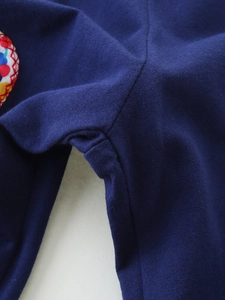 Girls navy cotton knit sports pants with colorful heart embroidery detail and ribbed fabric