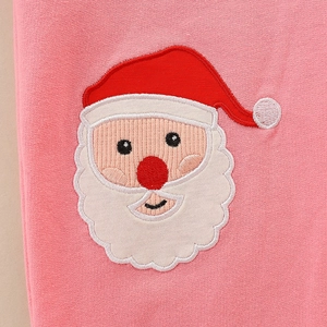 Pantalon en tricot rose pour enfant avec broderie Père Noël festive et texture douce
