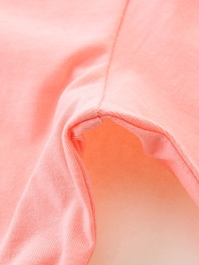 Pink knit cotton girls' long sleeve tee showing close-up of soft fabric texture and neat seams