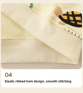 Detail of light yellow hoodie featuring elastic ribbed hem and neat stitching finish
