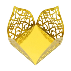 Detail of laser-cut gold gift box with ornate European pattern and metallic finish