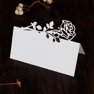 Elegant white laser-cut rose place cards for wedding tables with a 3D floral design