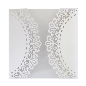 Detail of white laser-cut floral wedding invitation cover with intricate trifold pattern