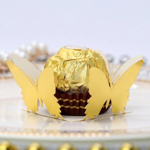 Laser cut hollow butterfly favor box in gold paper for wedding and party candy display