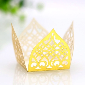 Detailed laser cut golden cupcake wrappers with intricate geometric lace patterns