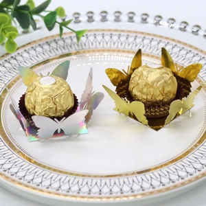 Detailed laser-cut butterfly chocolate wrappers in gold and holographic glitter finish