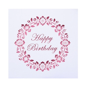 Detailed laser-cut floral wreath design on a premium white Happy Birthday greeting card