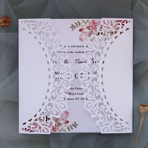 Elegant white laser-cut floral wedding invitation with pink rose inner card on grey mesh