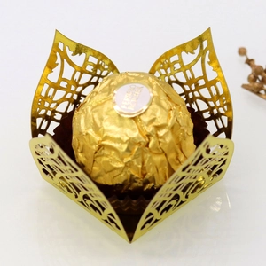 Detailed laser-cut gold lace favor box with intricate floral hollow pattern for chocolate
