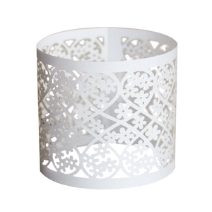 Detailed laser-cut pearl paper napkin ring with white lace floral and heart patterns