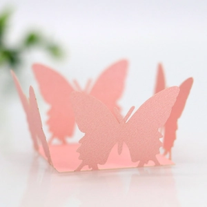 Detailed laser-cut pink butterfly paper chocolate wrap with subtle pearlescent texture