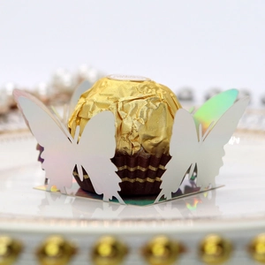 Iridescent laser cut butterfly chocolate holder for elegant wedding party favors