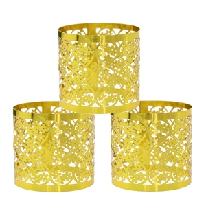 Detailed view of three gold cutout napkin rings with intricate lace patterns and mirror finish