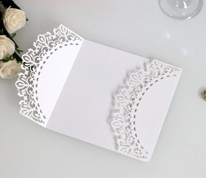 Laser cut white lace wedding invitation card with elegant floral hollow patterns