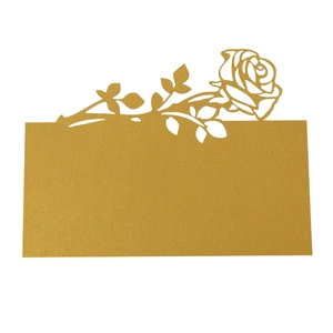 Detailed laser-cut gold rose table name card with intricate hollow-out floral patterns