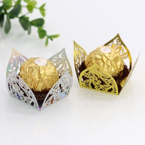 Detailed laser-cut butterfly chocolate wrappers in gold and iridescent silver paper