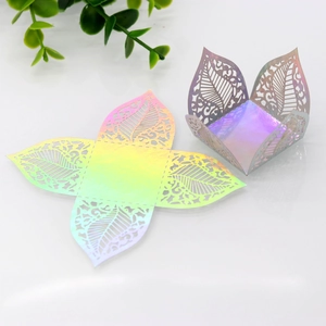 Close-up of laser-cut hollow leaf pattern on iridescent laser cardstock candy box