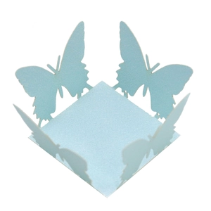 Macro shot of sky blue pearlescent candy box with laser cut hollow butterfly designs
