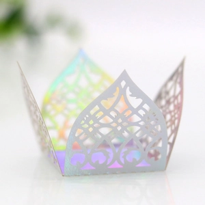 Macro detail of laser-cut hollow pattern and holographic shimmer on wedding favor boxes