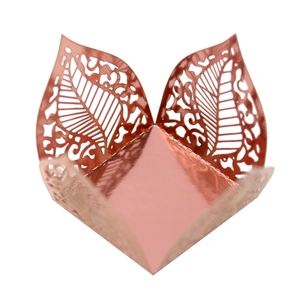 Detailed laser-cut hollow leaf pattern on rose gold metallic paper for wedding gift boxes