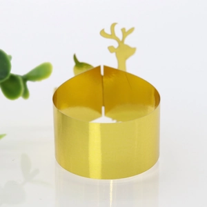 Macro detail of gold mirrored elk silhouette napkin ring with smooth metallic finish