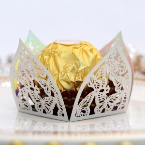 Detailed laser-cut butterfly chocolate wrapper in white pearlescent paper for weddings