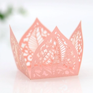 Detailed laser-cut pink hollow leaf paper favor box with elegant floral patterns