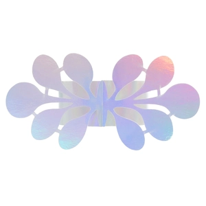 Detail of laser cut iridescent napkin ring showing butterfly pattern and metallic texture