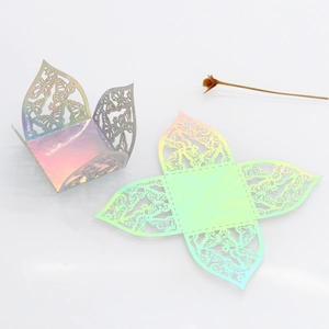 Detailed laser-cut iridescent butterfly favor boxes for wedding candy and party decor
