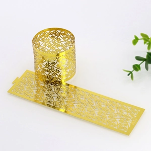 Detailed laser-cut floral pattern on gold metallic napkin rings for table settings