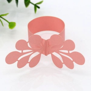 Close-up of pink laser-cut butterfly napkin ring made of premium pearlescent paper