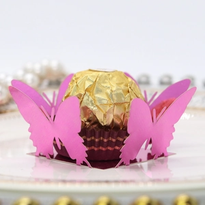 Pink laser-cut butterfly chocolate wrapper in pearlescent paper for party favors