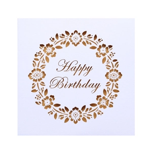 Detail of laser-cut square birthday card with elegant floral wreath and Happy Birthday text