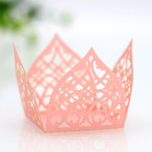 Detail showing laser-cut floral hollow pattern on pearlescent pink paper gift box