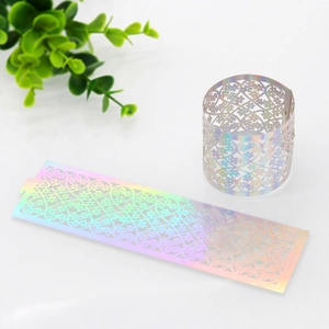 Detailed laser-cut iridescent floral napkin ring with intricate hollow lace pattern