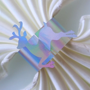 Iridescent laser cut Christmas reindeer napkin ring with reflective metallic finish