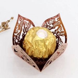 Laser-cut rose gold butterfly chocolate wrapper with gold foil truffle detail