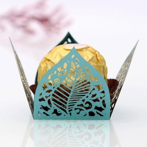 Detailed laser-cut leaf pattern chocolate wrapper in elegant morandi teal finish