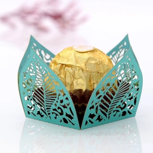 Tiffany blue laser-cut hollow leaf candy box with a mirror reflection on white background
