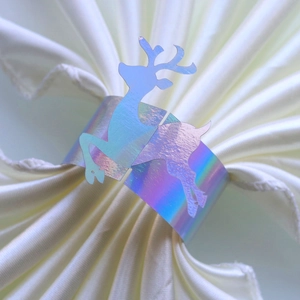 Holographic reindeer napkin ring with iridescent finish for Christmas table decoration