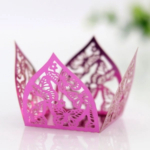 Detail of laser-cut butterfly cupcake wrappers in shiny magenta and purple art paper
