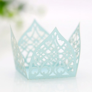 Detailed laser-cut light blue paper lace wrapper with intricate European floral patterns
